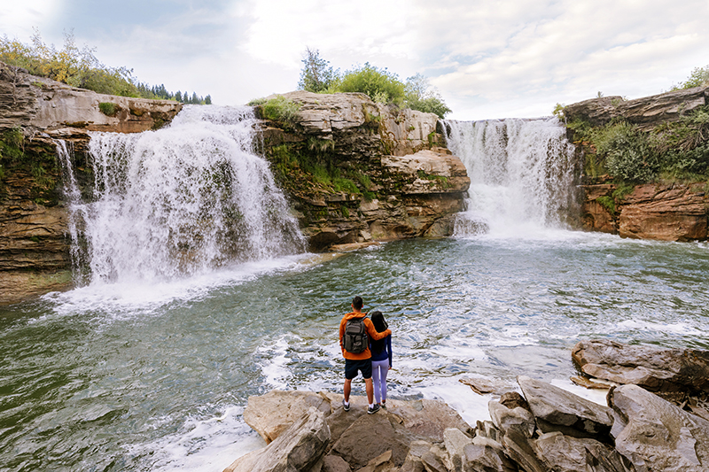 Couple looking at Lundbreck Falls