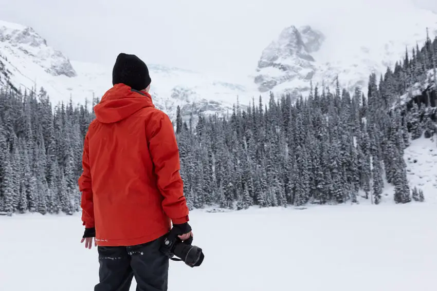 Photographer taking pictures of a Canadian Mountain Landscape