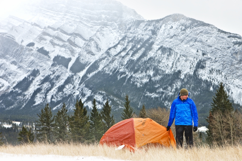 Man standing outside his tent