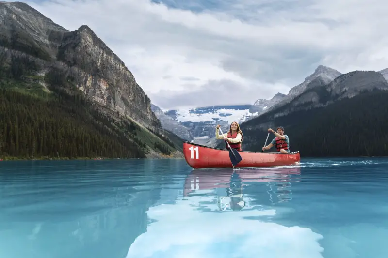 Couple paddleboarding at Lake Louise in Banff National Park