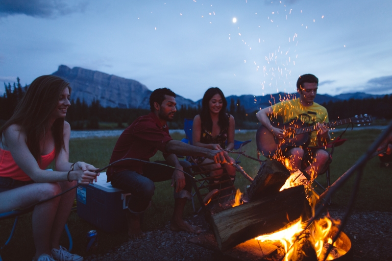 Group of friends camping in summer